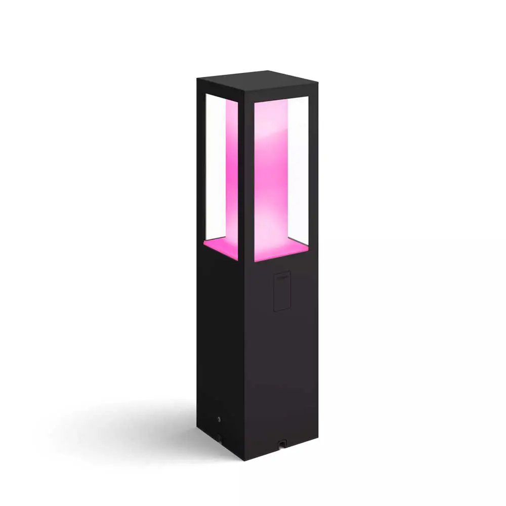 Baliza Impress Philips Hue negro encendida con iluminación LED en tono rosa.