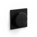 Vista frontal del Interruptor Tap Switch negro Philips Hue instalado en pared.