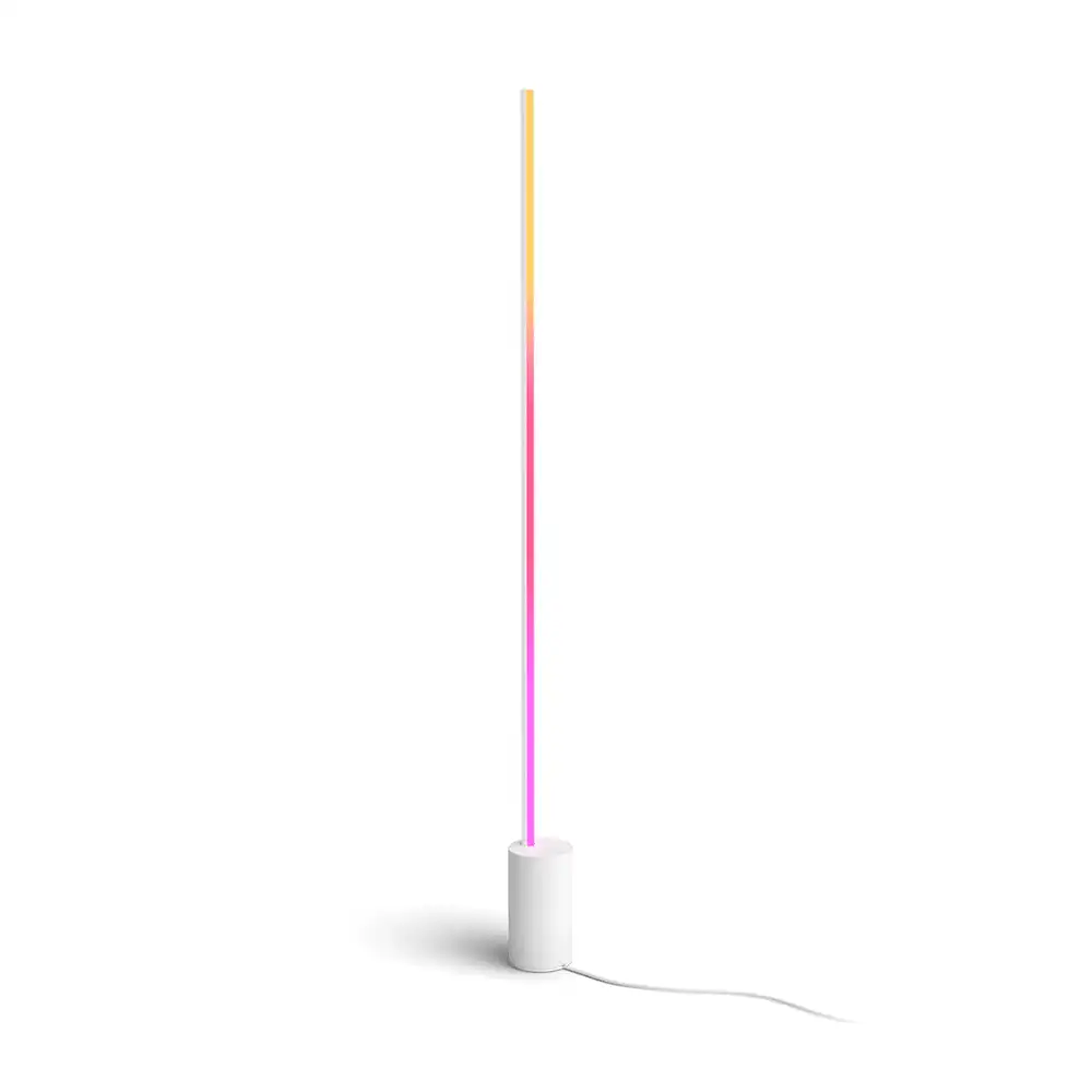 Lámpara de suelo Gradient Signe Philips Hue blanca encendida con degradado multicolor vertical