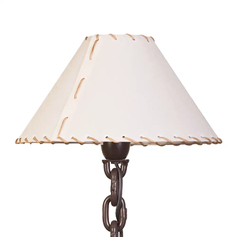 Lámpara de mesa con pantalla textil.